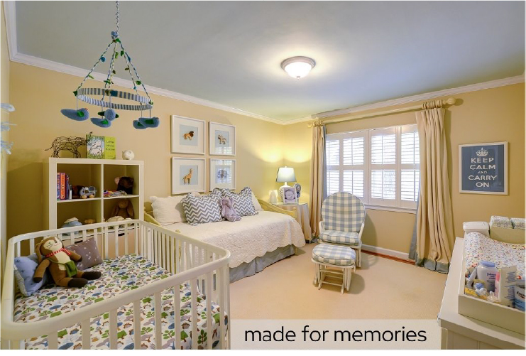 a quaint, pale yellow baby's room with a crib and rocking chair
